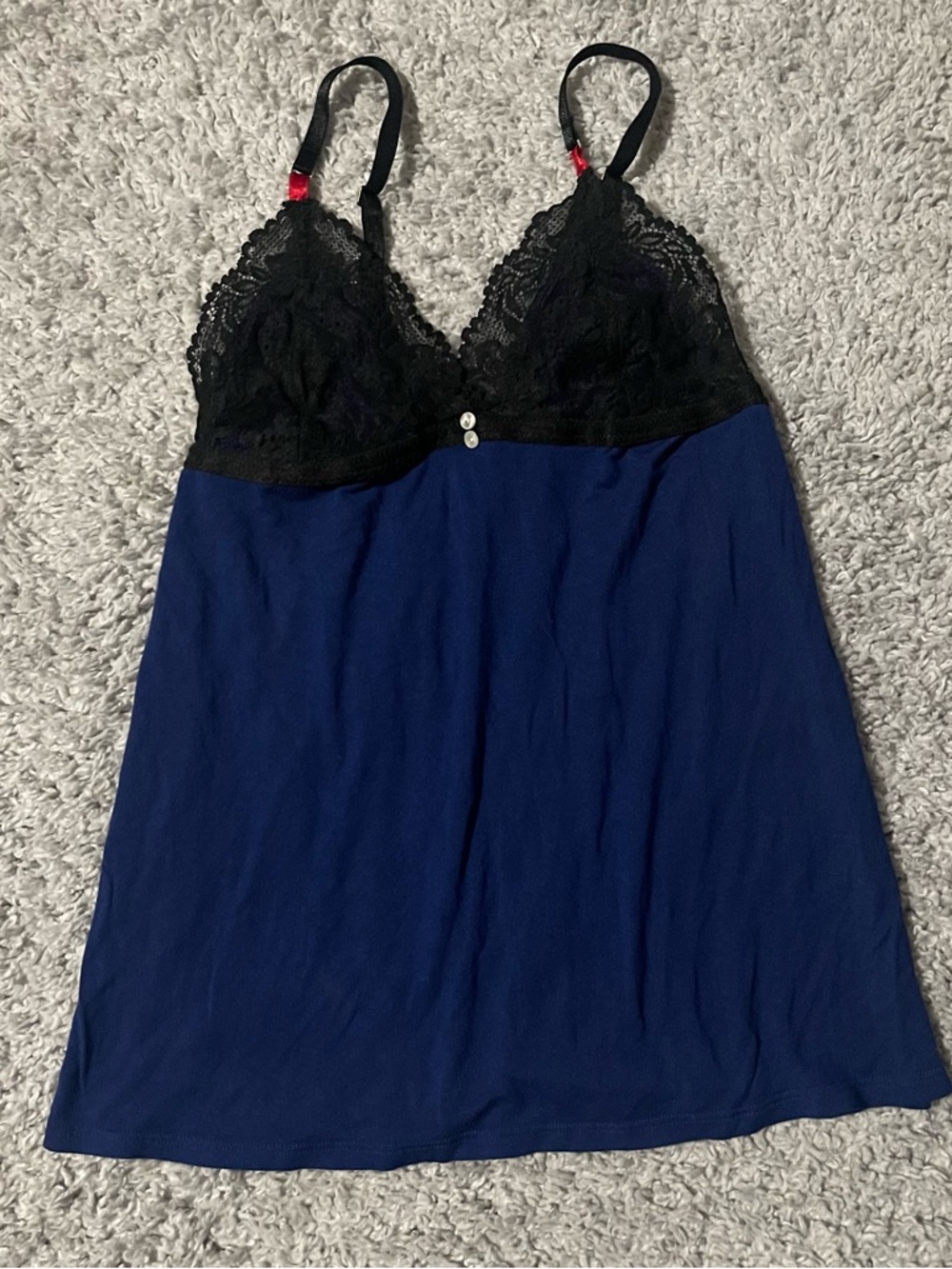 Cosmopolitan Y2K navy babydoll top with black lace detail and red accents